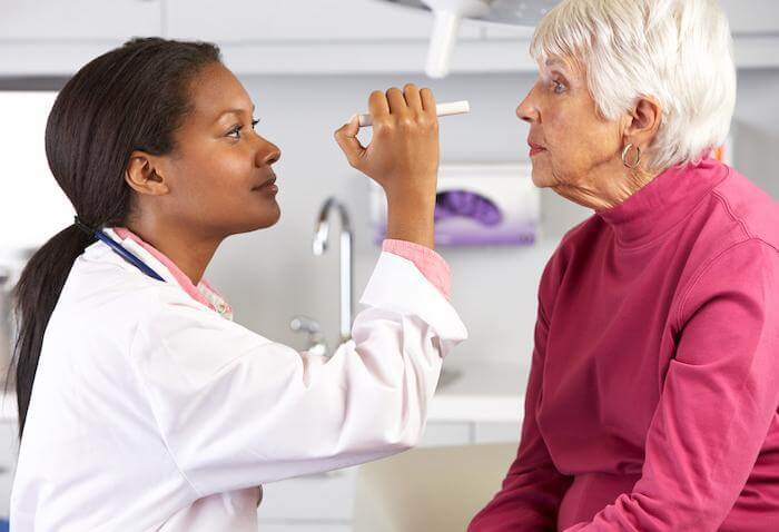 Woman having her eyes examined